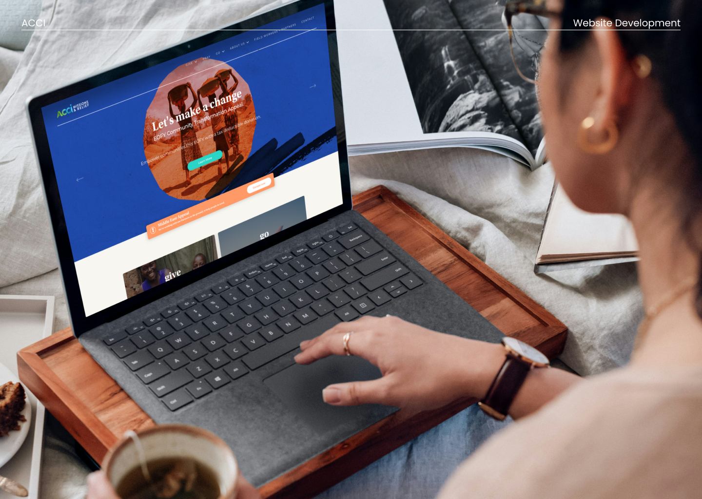The ACCI Missions & Relief website open on a laptop, showing the End of Financial Year donation appeal
